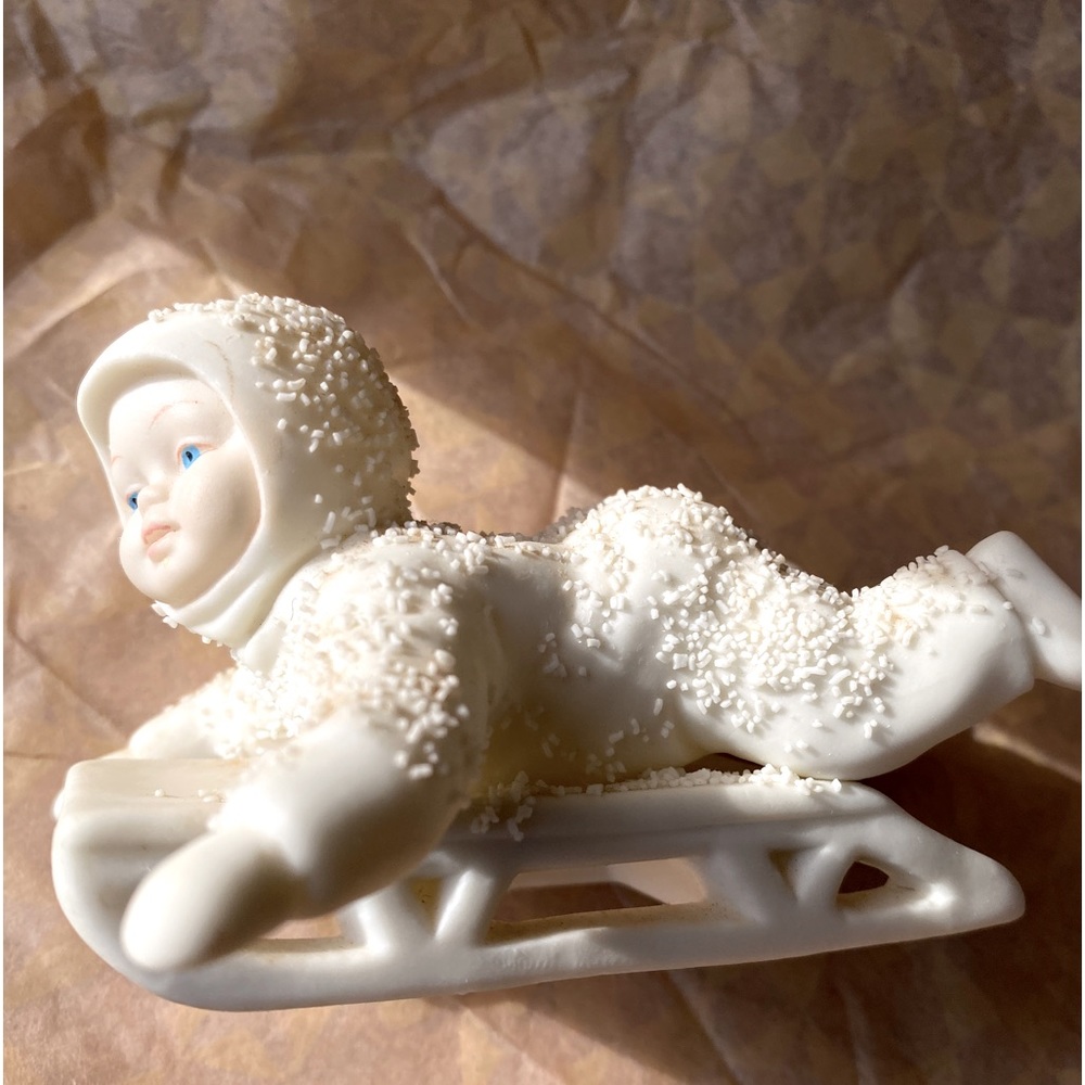 Snowbabies on sled This Christmas Season add this special Department 56 Snowbaby